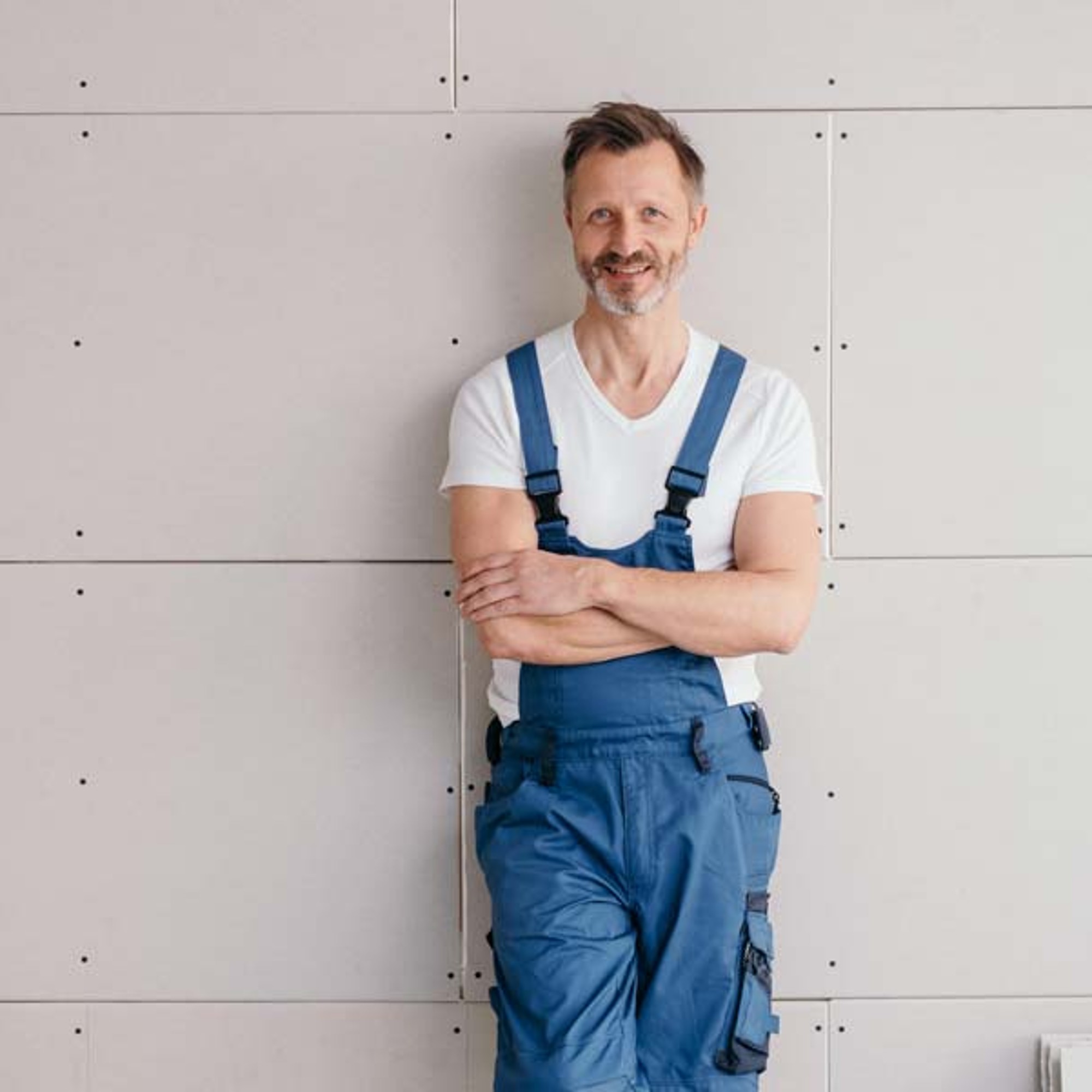 Craftsman leaning against a wall.