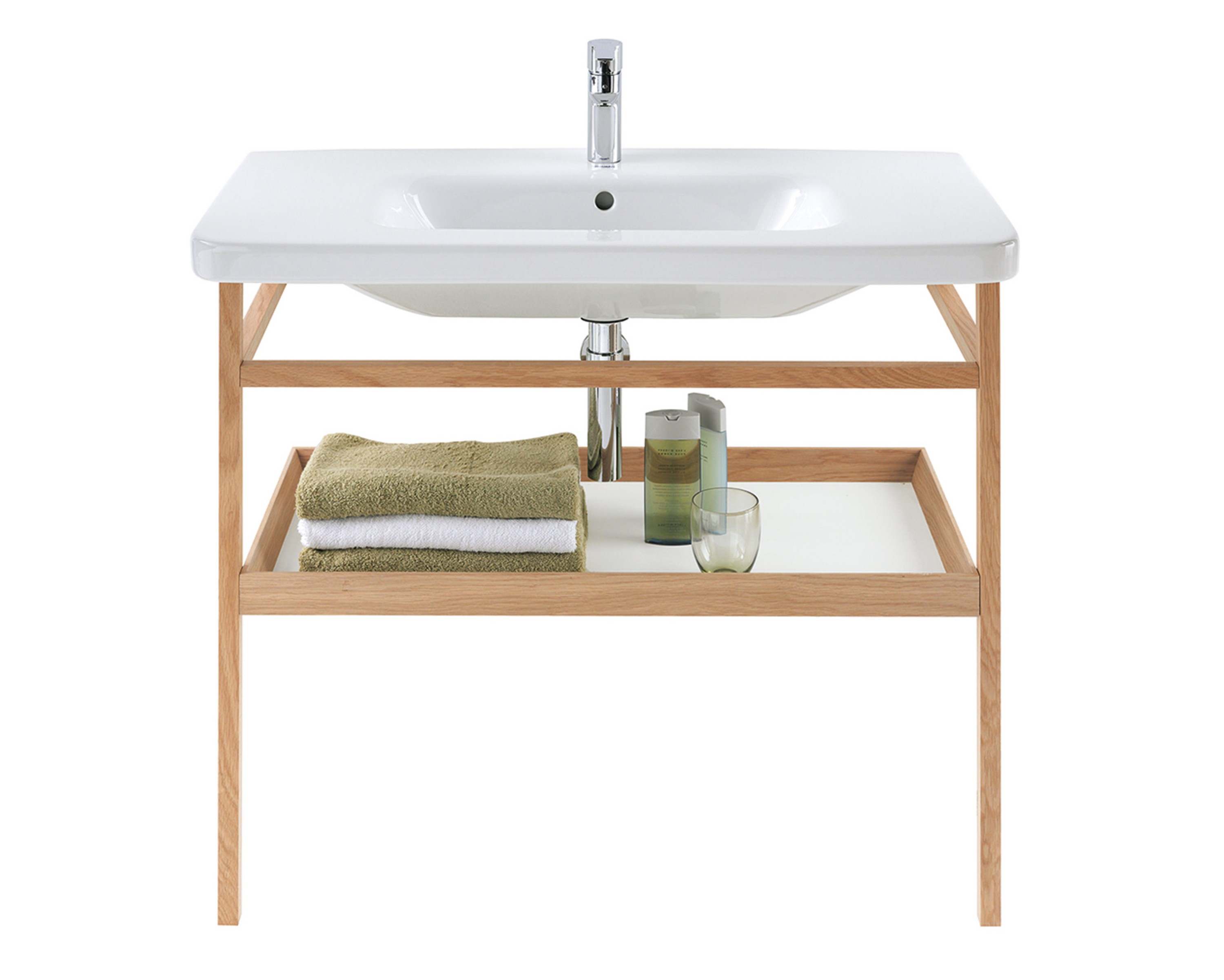 Duravit DuraStyle rectangular sink with wooden base unit; towels, bottles, and glass on shelf inside.