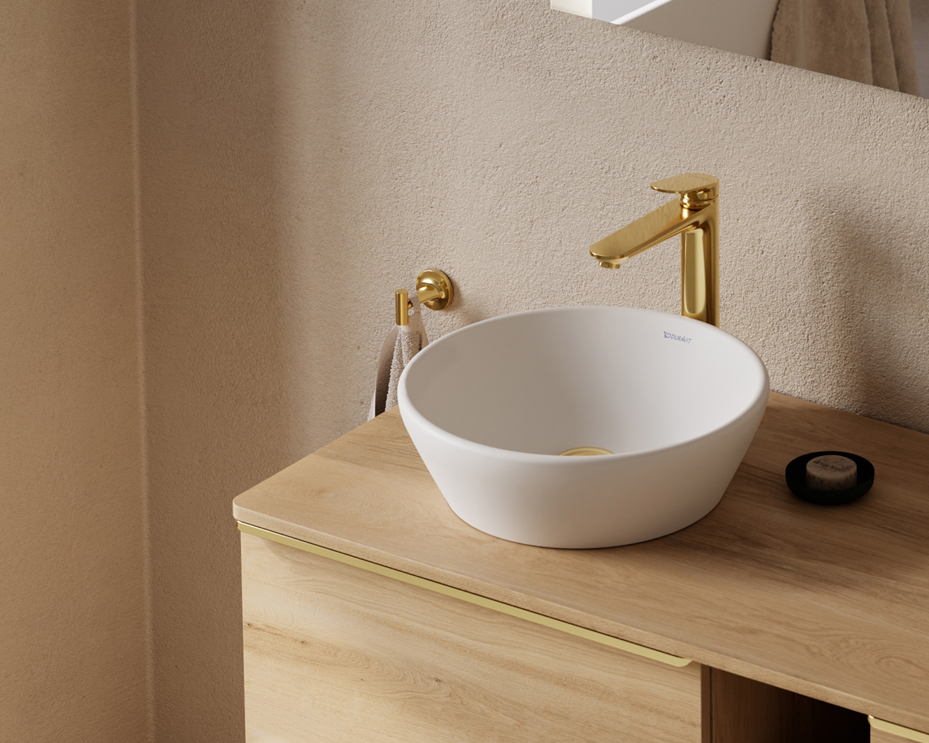 Single-lever basin mixer from the Duravit Wave series in polished gold