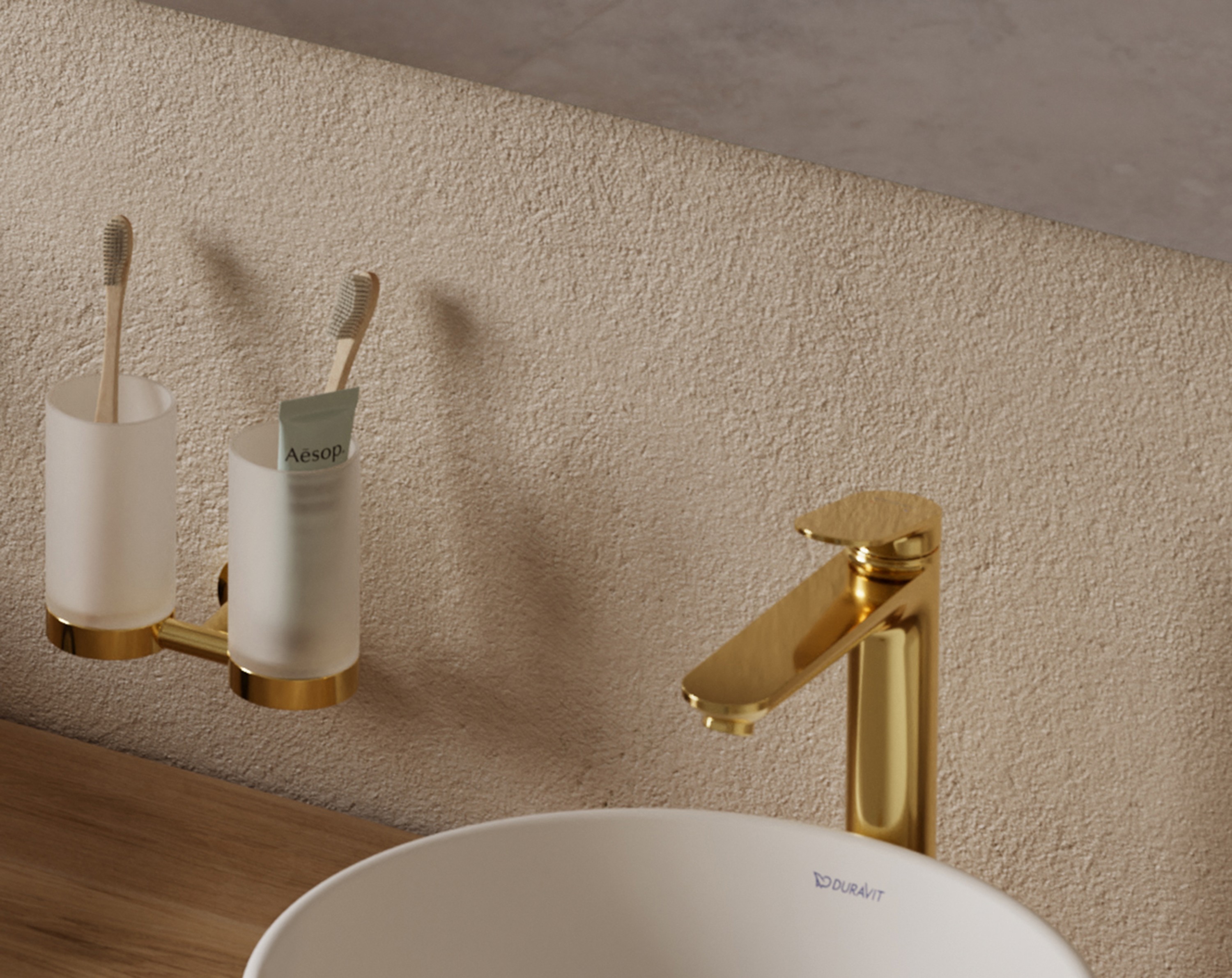 Golden faucets and accessories from the Duravit Wave series