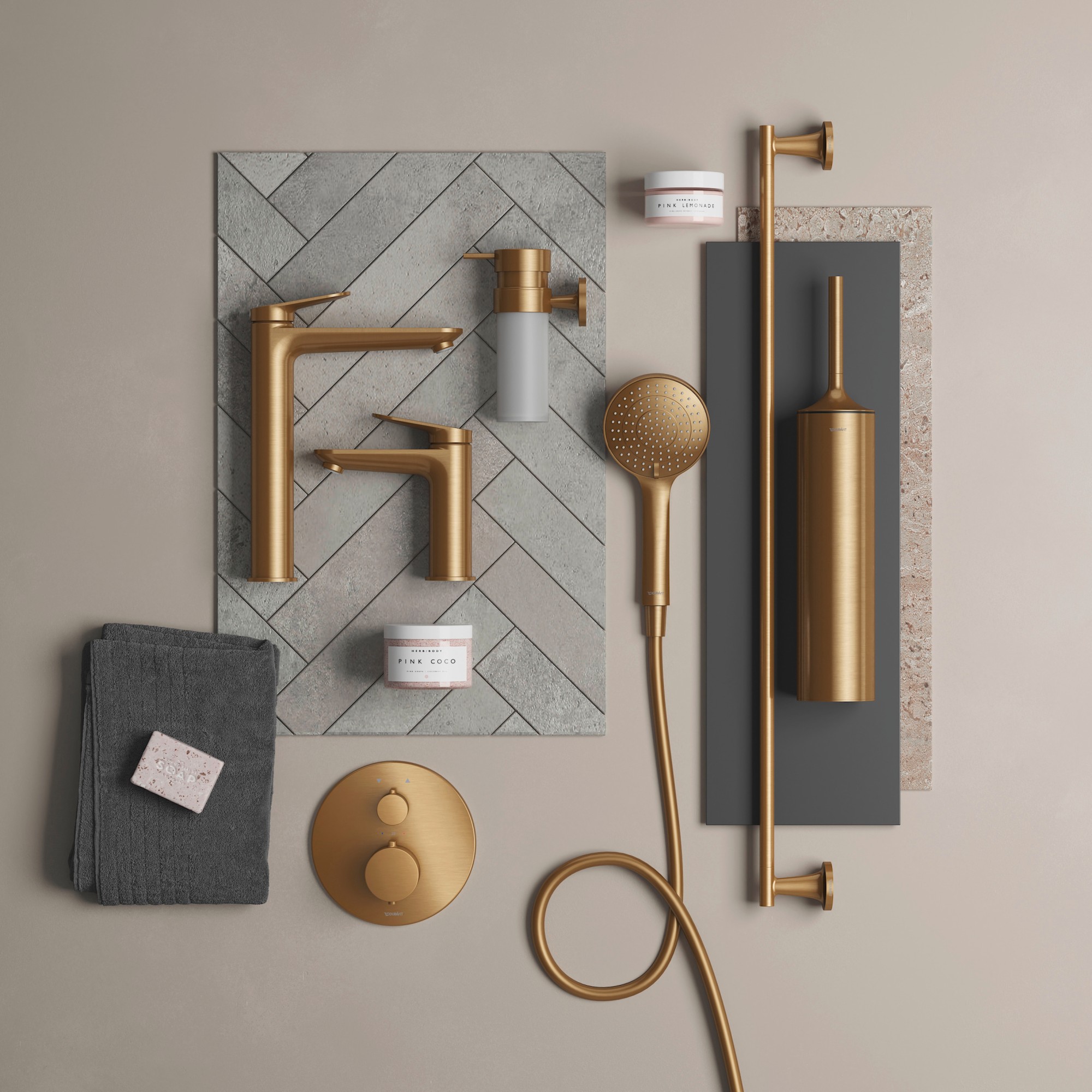 Bathroom faucets and accessories from different Duravit series in brushed bronze