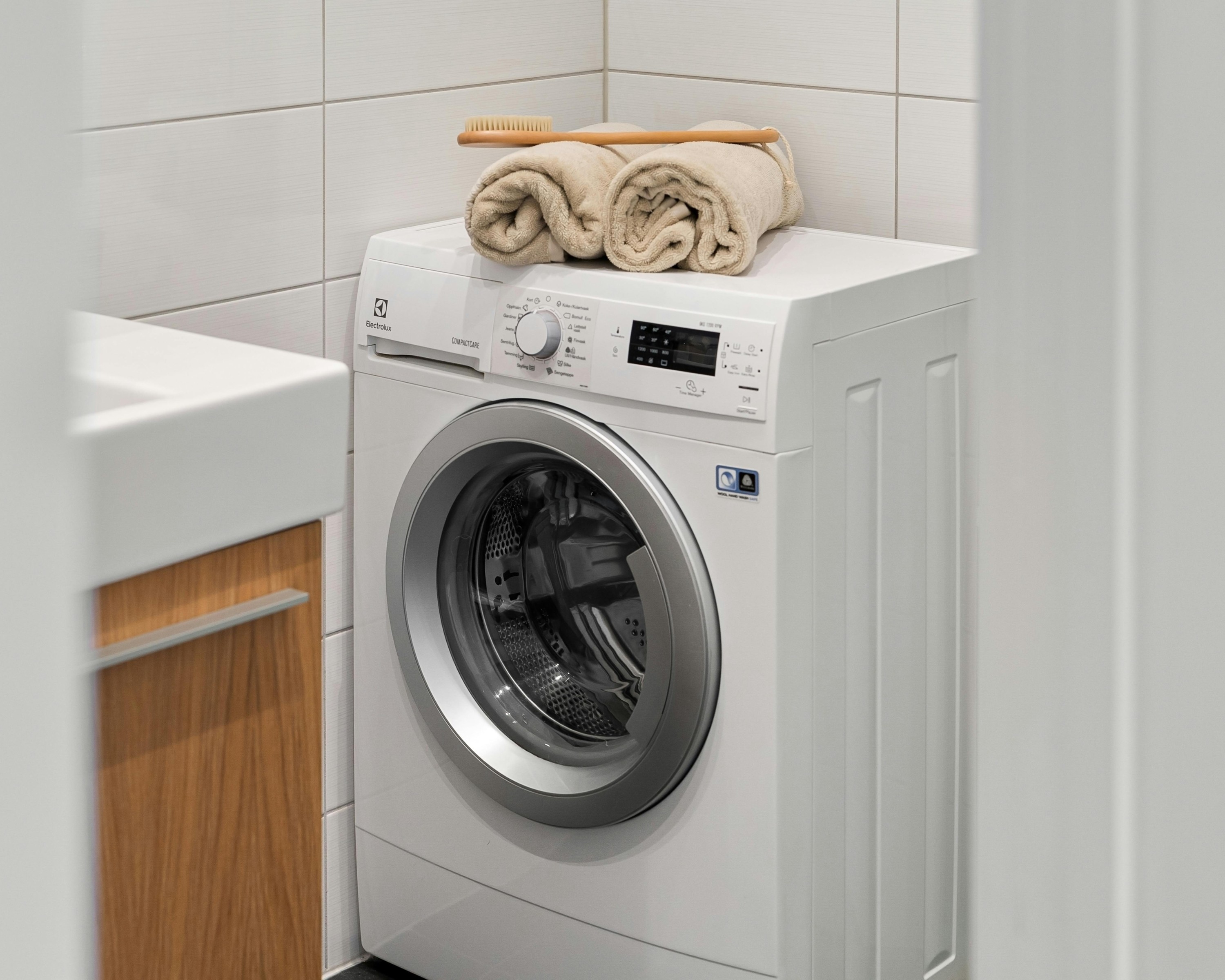 A modern washing machine in a bright bathroom