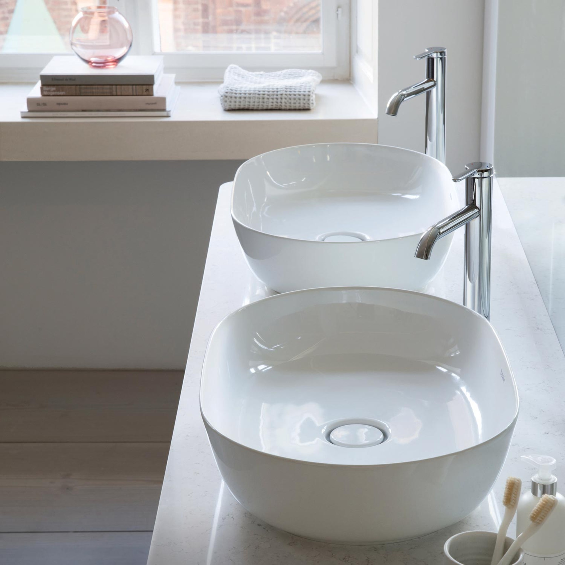 2 white Duravit Luv sinks side by side