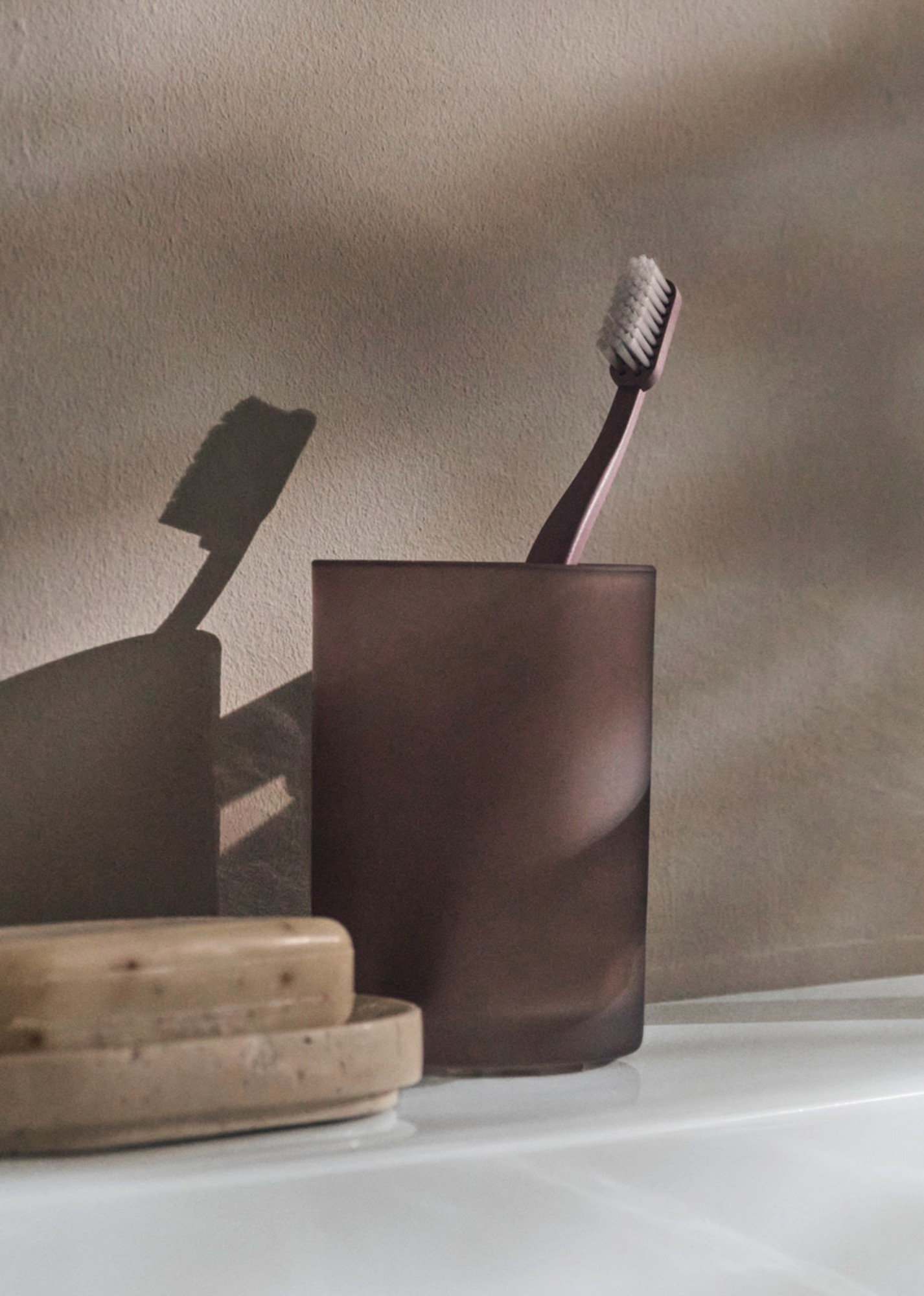 Accessories on the edge of a Collection One sink