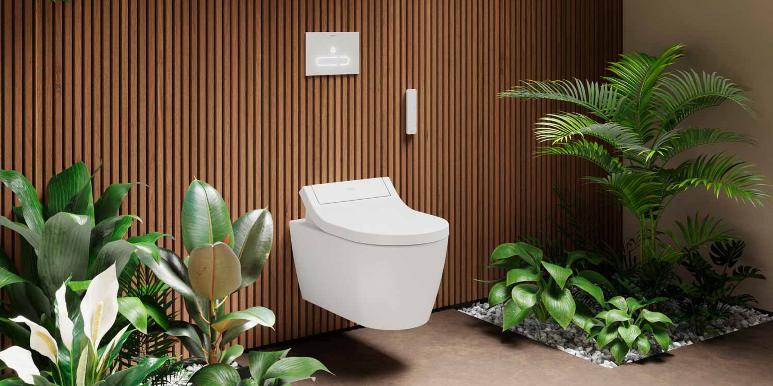Wand-WC der Serie Duravit SensoWash Classic in einem Badezimmer mit Planzen