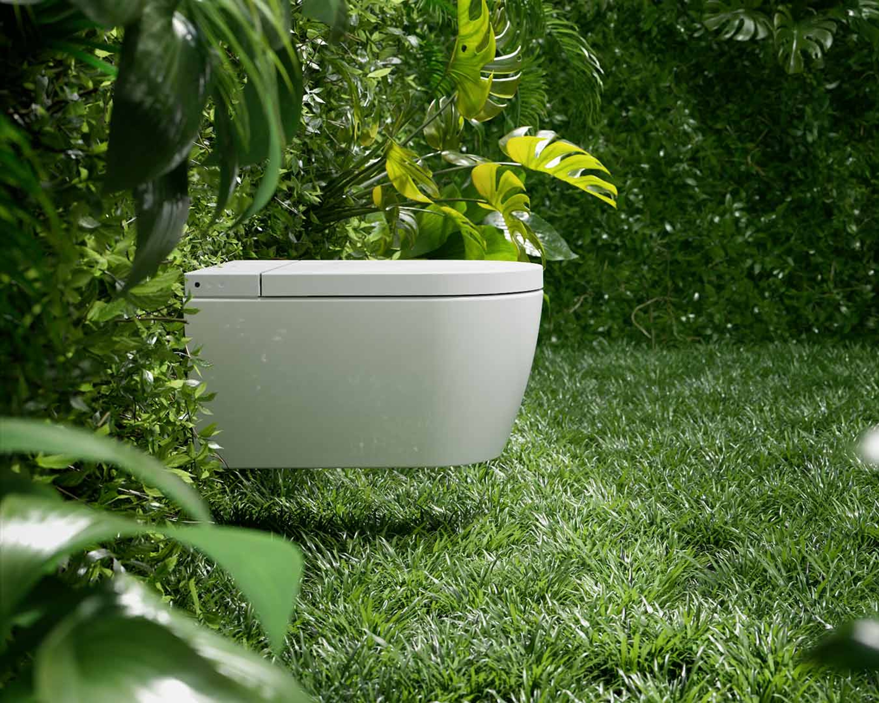 Side view of a Duravit SensoWash Starck f shower toilet on a plant wall