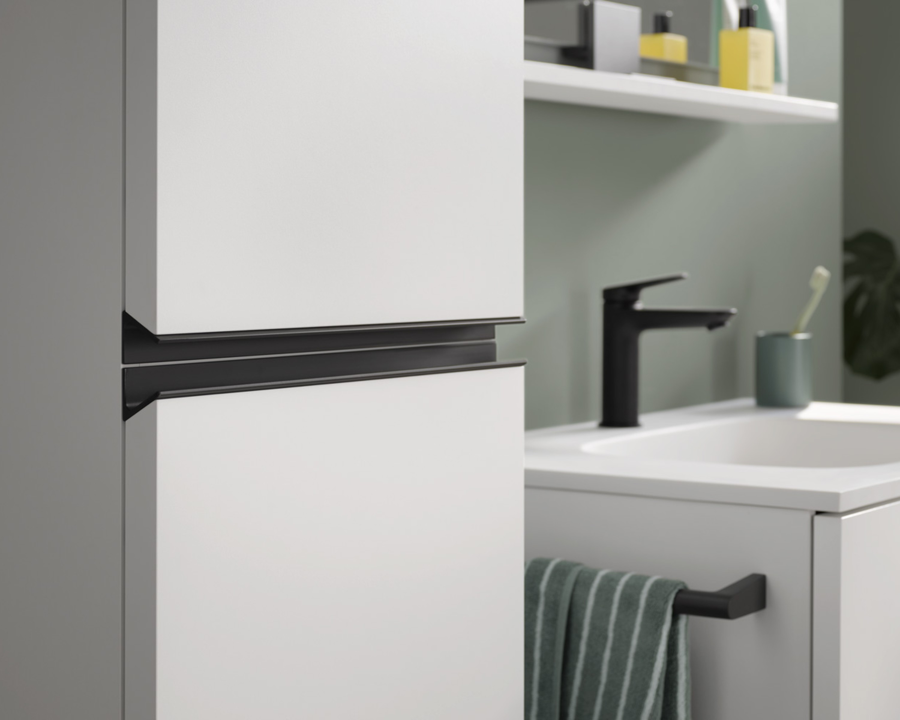 Partial view of a tall cabinet from the Duravit Sivida series, sink in the background