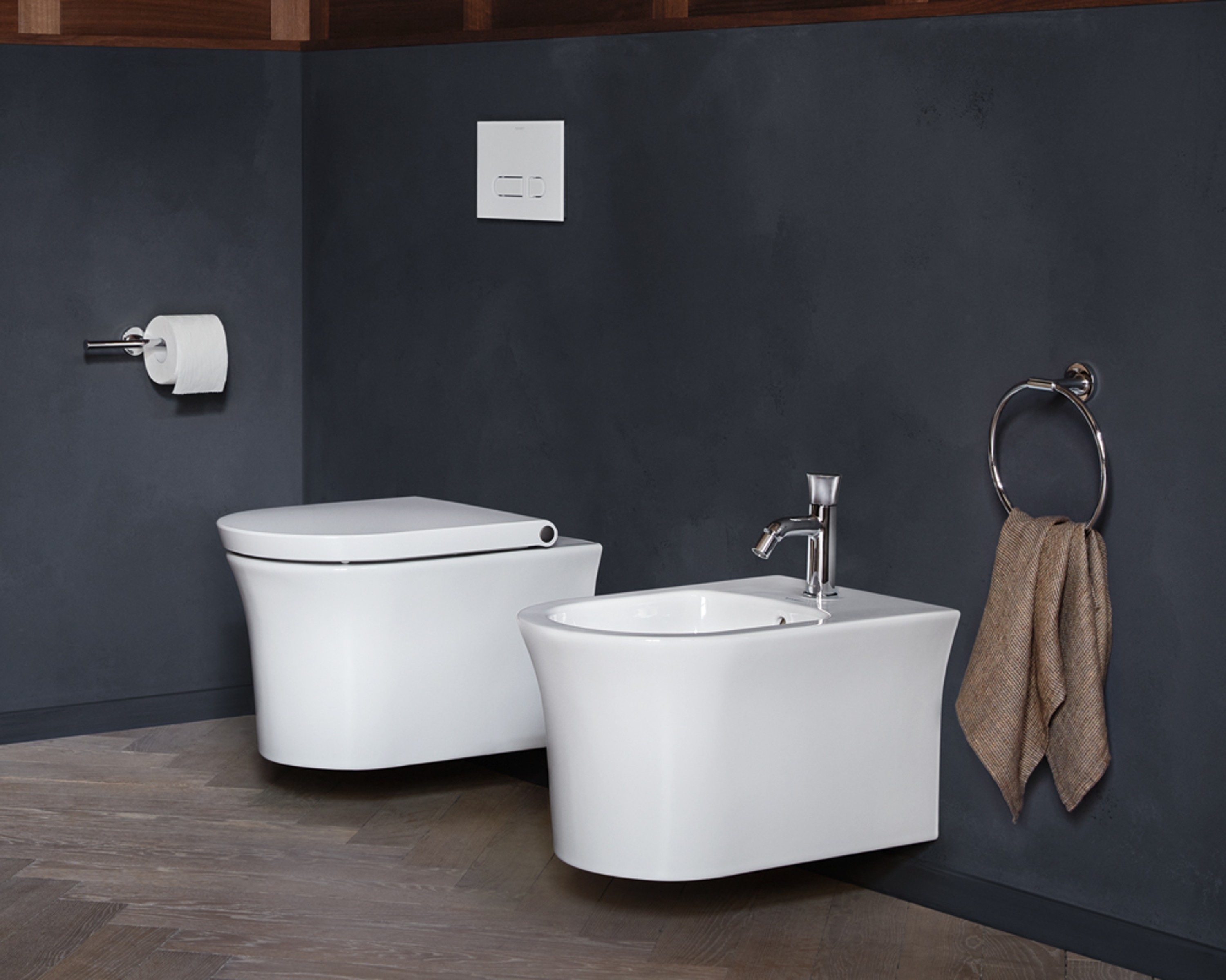 Wall-mounted White Tulip toilet and bidet