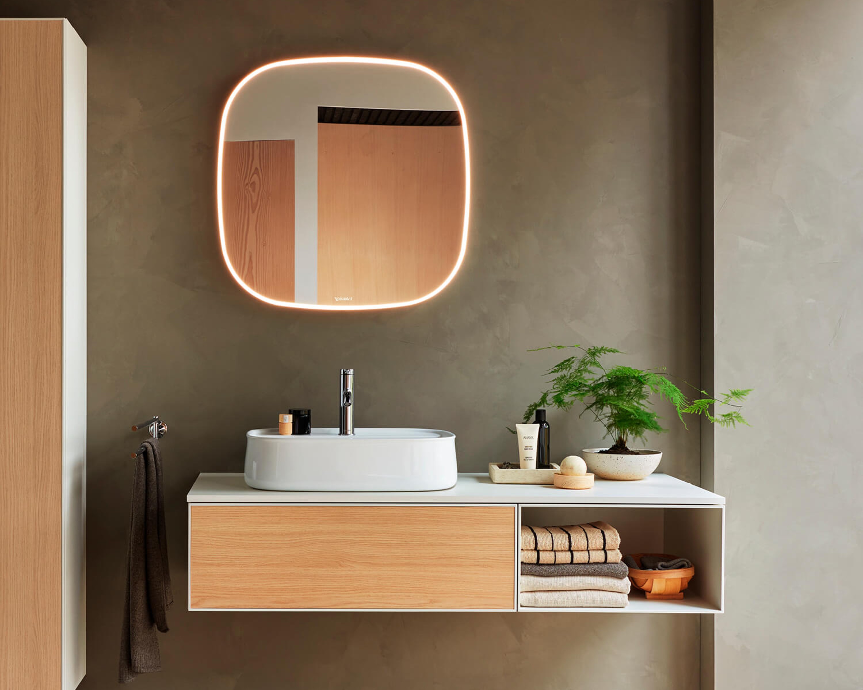 Bathroom mirror, countertop sink, and console vanity unit from the Zencha series