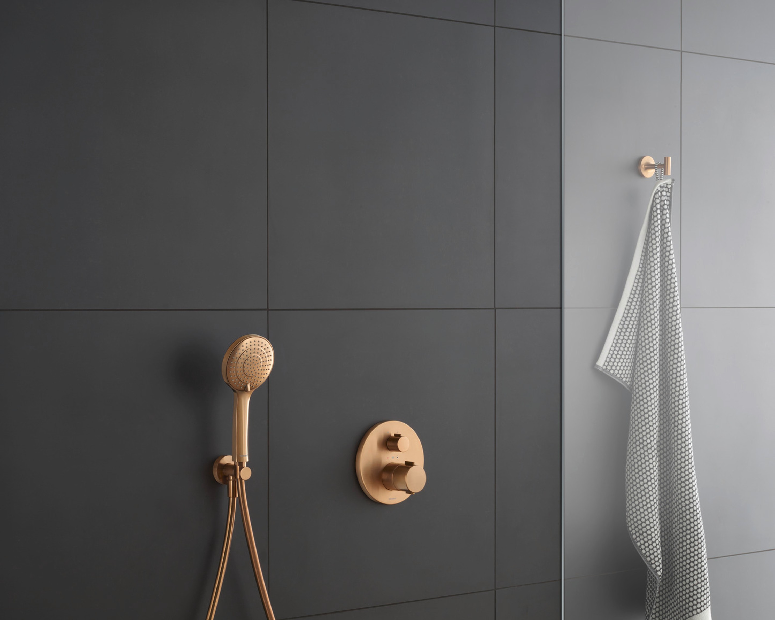 Duravit shower faucet and shower head in brushed bronze
