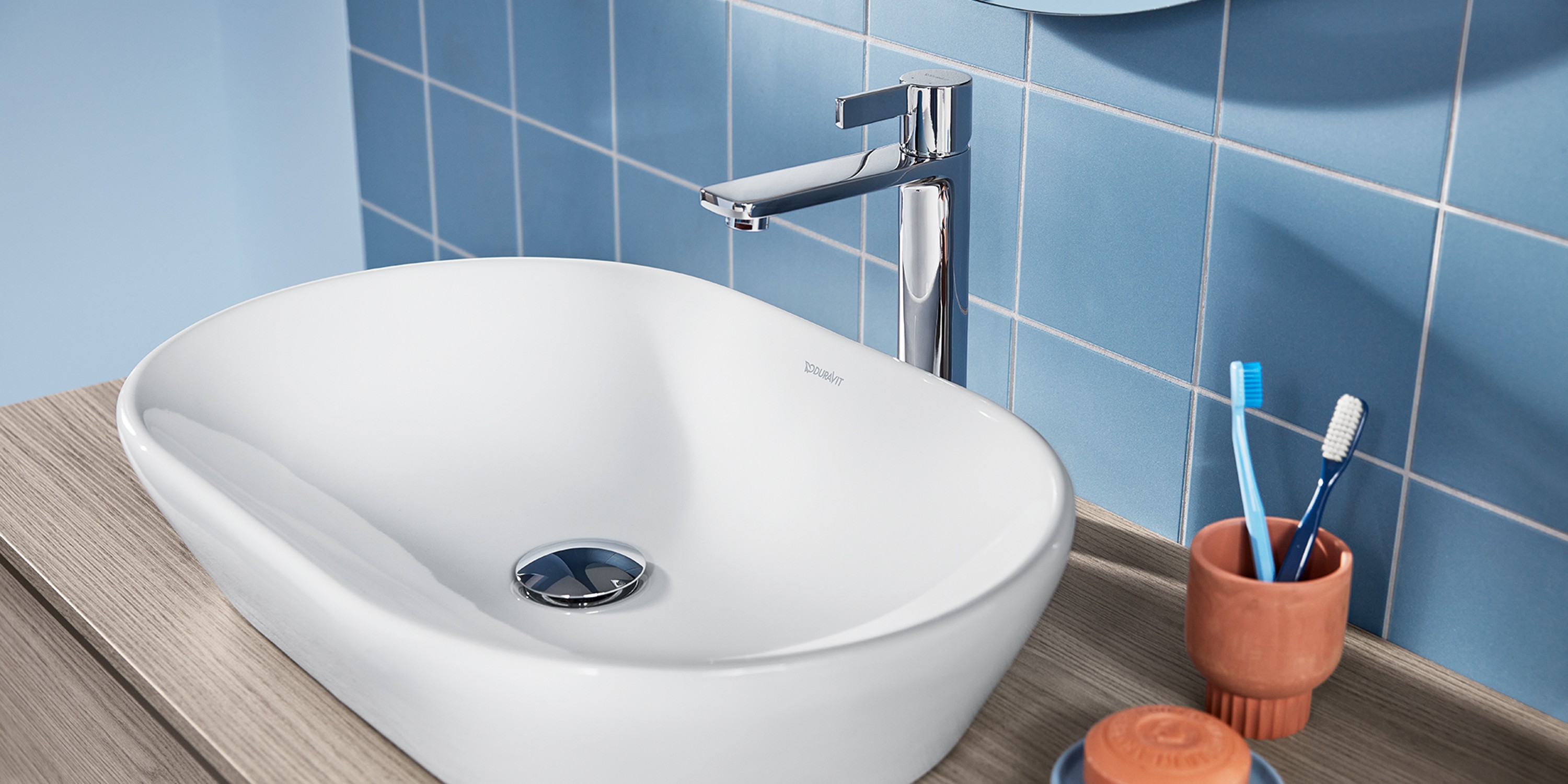Duravit D-Neo series countertop sink with blue tiles