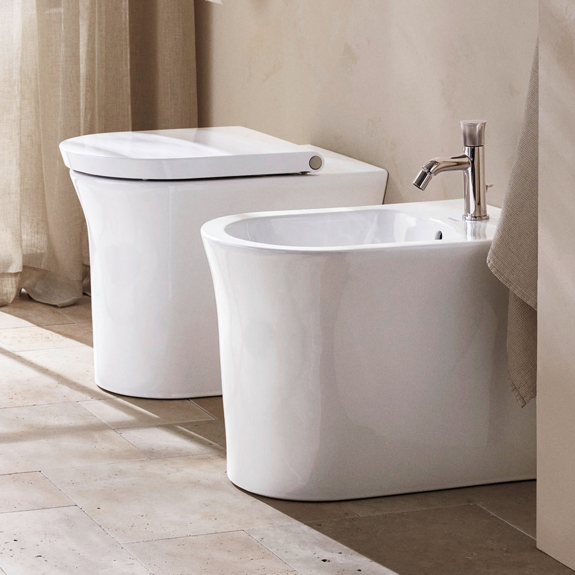 Duravit White Tulip floor-standing toilet next to a floor-standing bidet