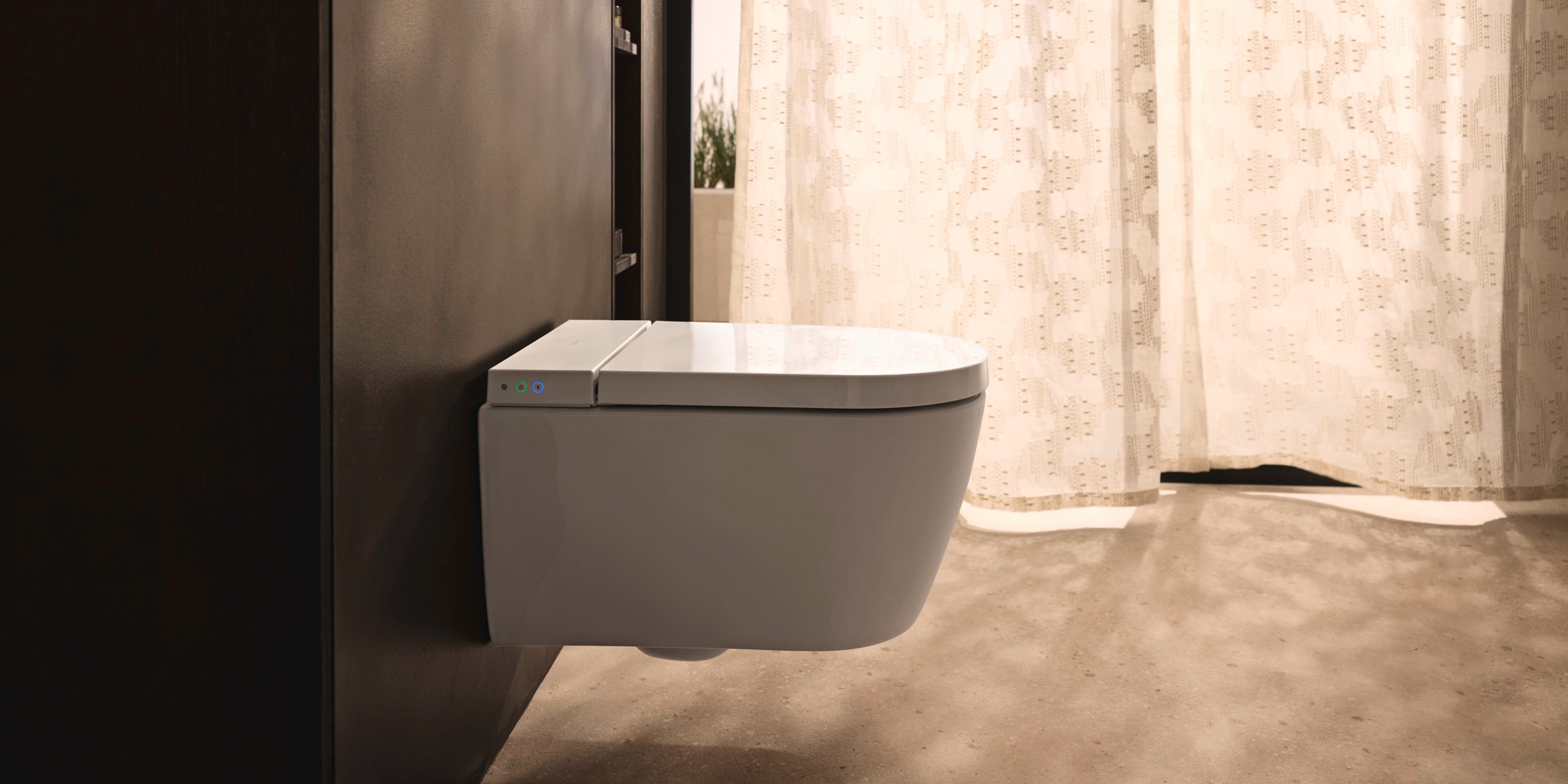 Wall-mounted toilet from the Duravit SensoWash Starck f series in a natural setting
