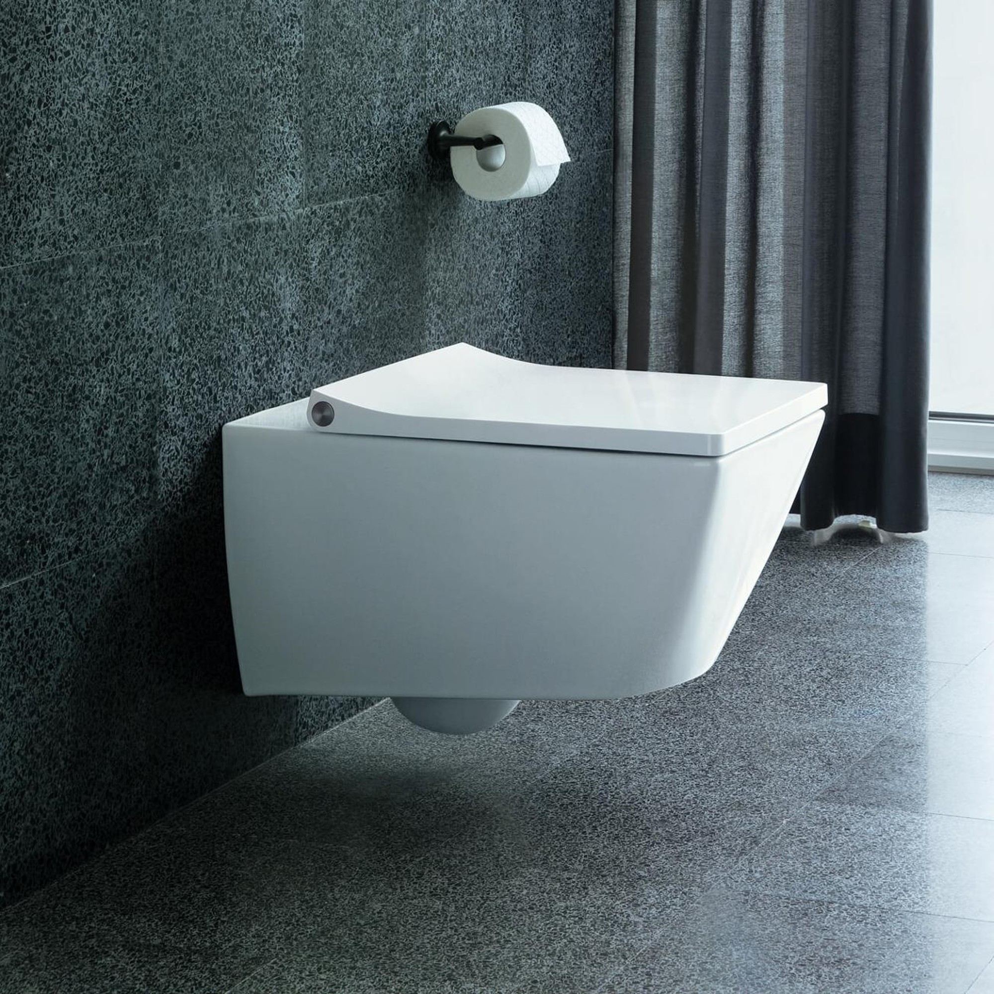 Wall-mounted Duravit toilet in grey bathroom
