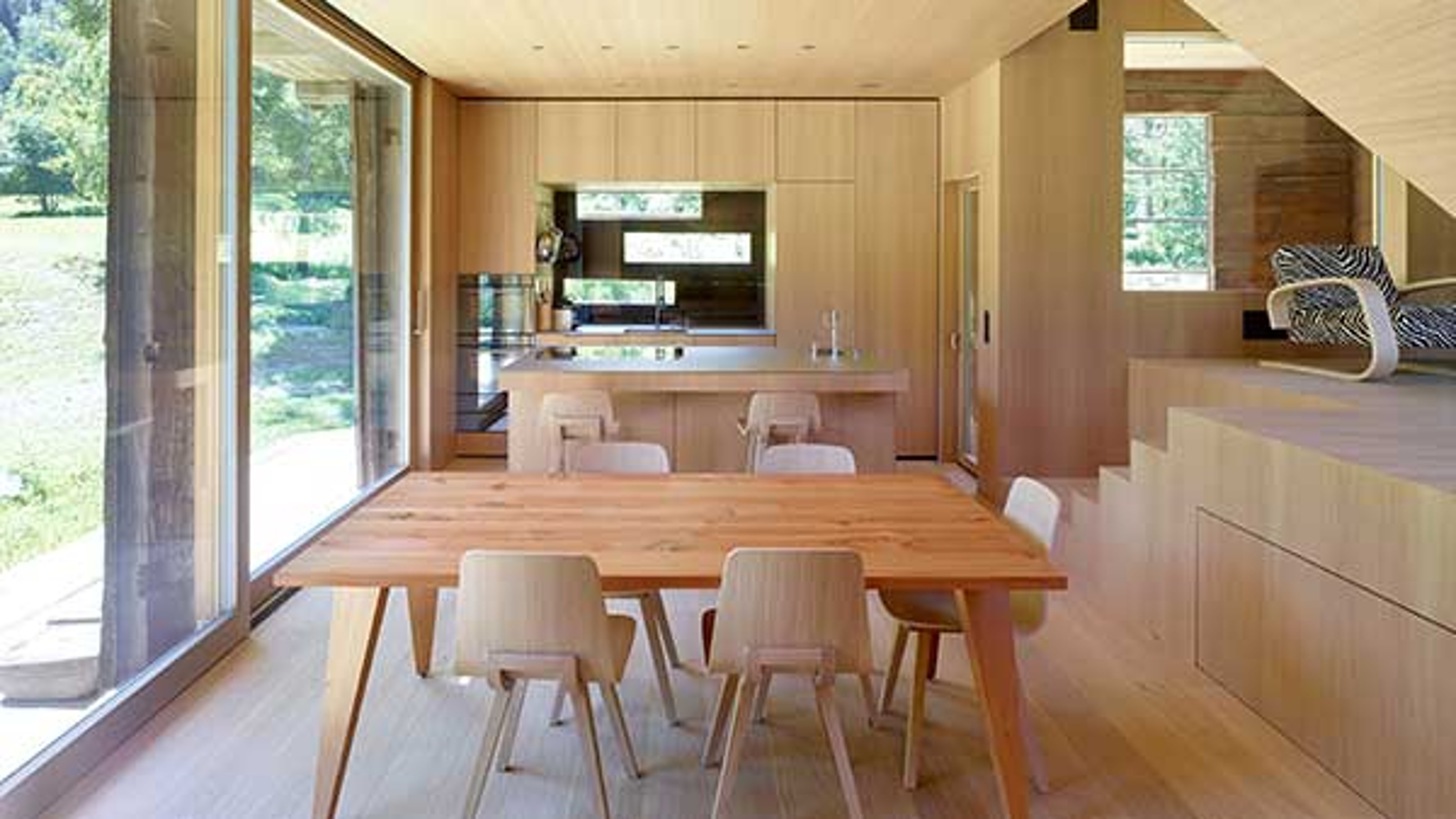 Chalet, dining table in the foreground, kitchen in the background