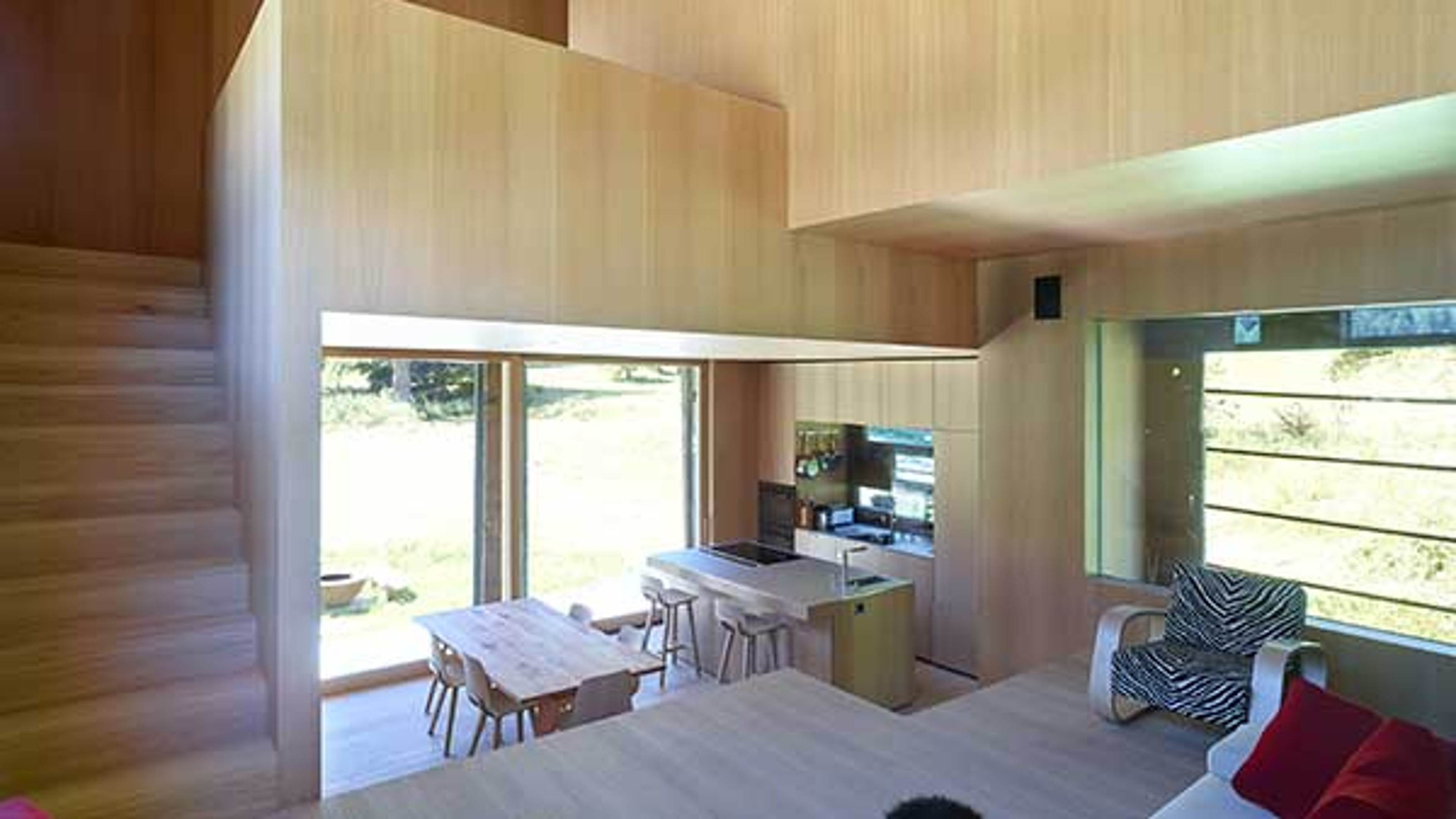 Chalet, seating area with view of the dining area, stairs on the left