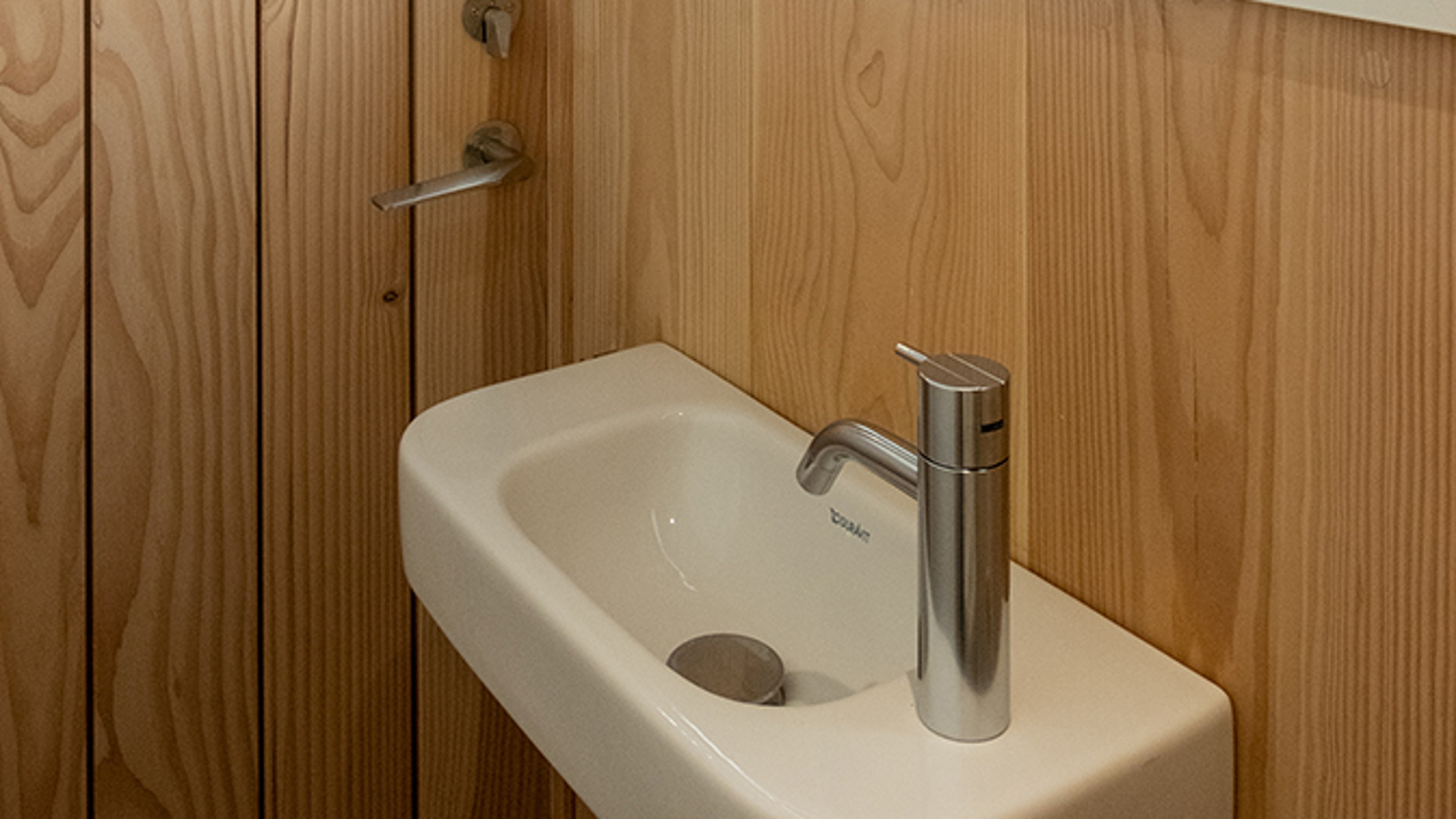 FEM Tiny House, hand basin with illuminated mirror cabinet