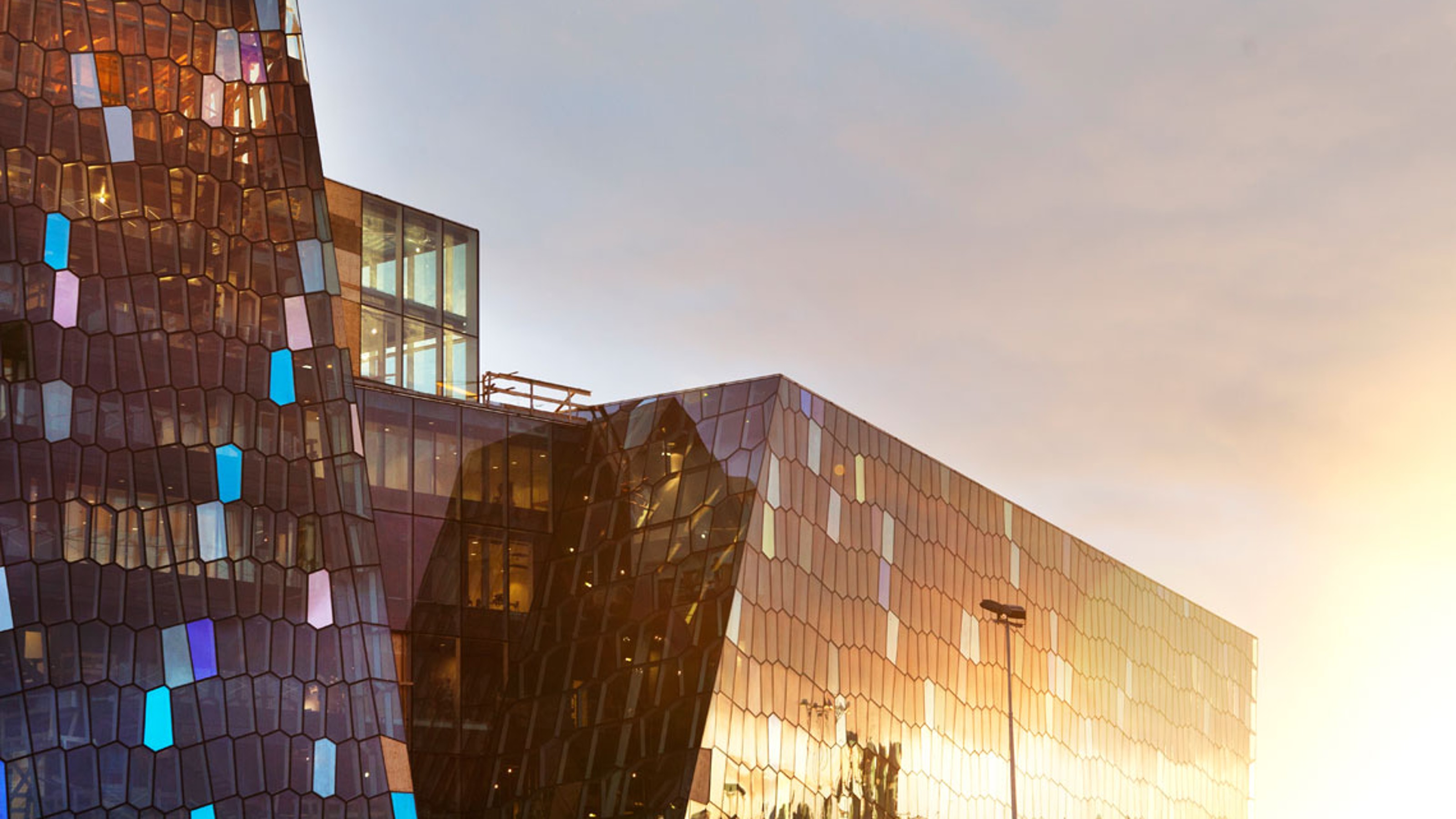 Harpa Concert Hall, exterior view of the building at sunset, reflected in the building