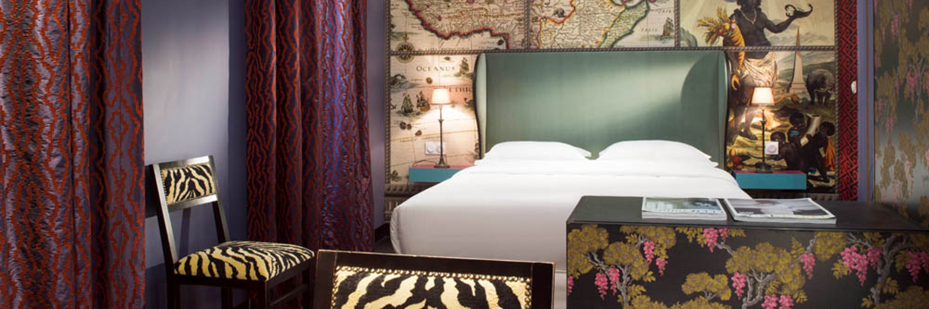 Hotel du Continent, colourfully decorated hotel room