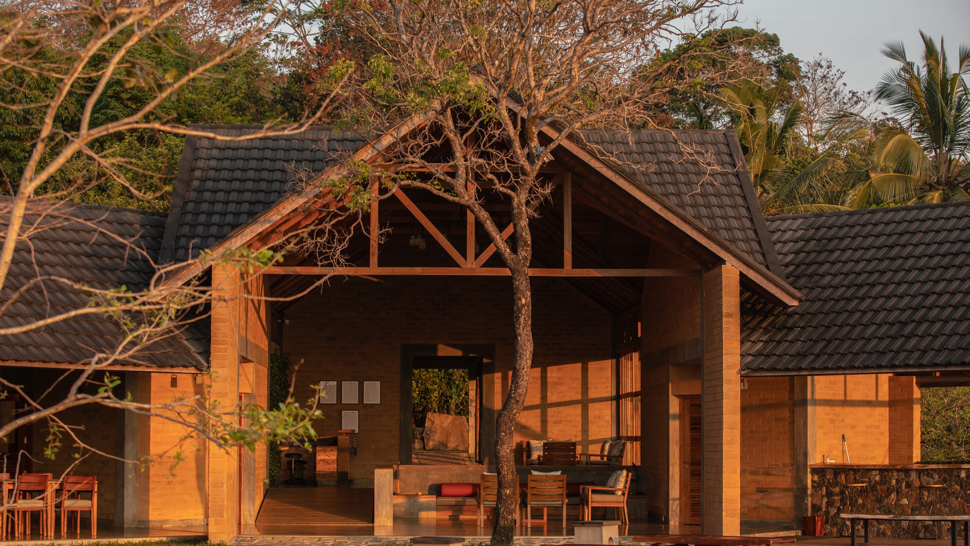 Prakriti Shakti Resort, exterior view of the building at sunset
