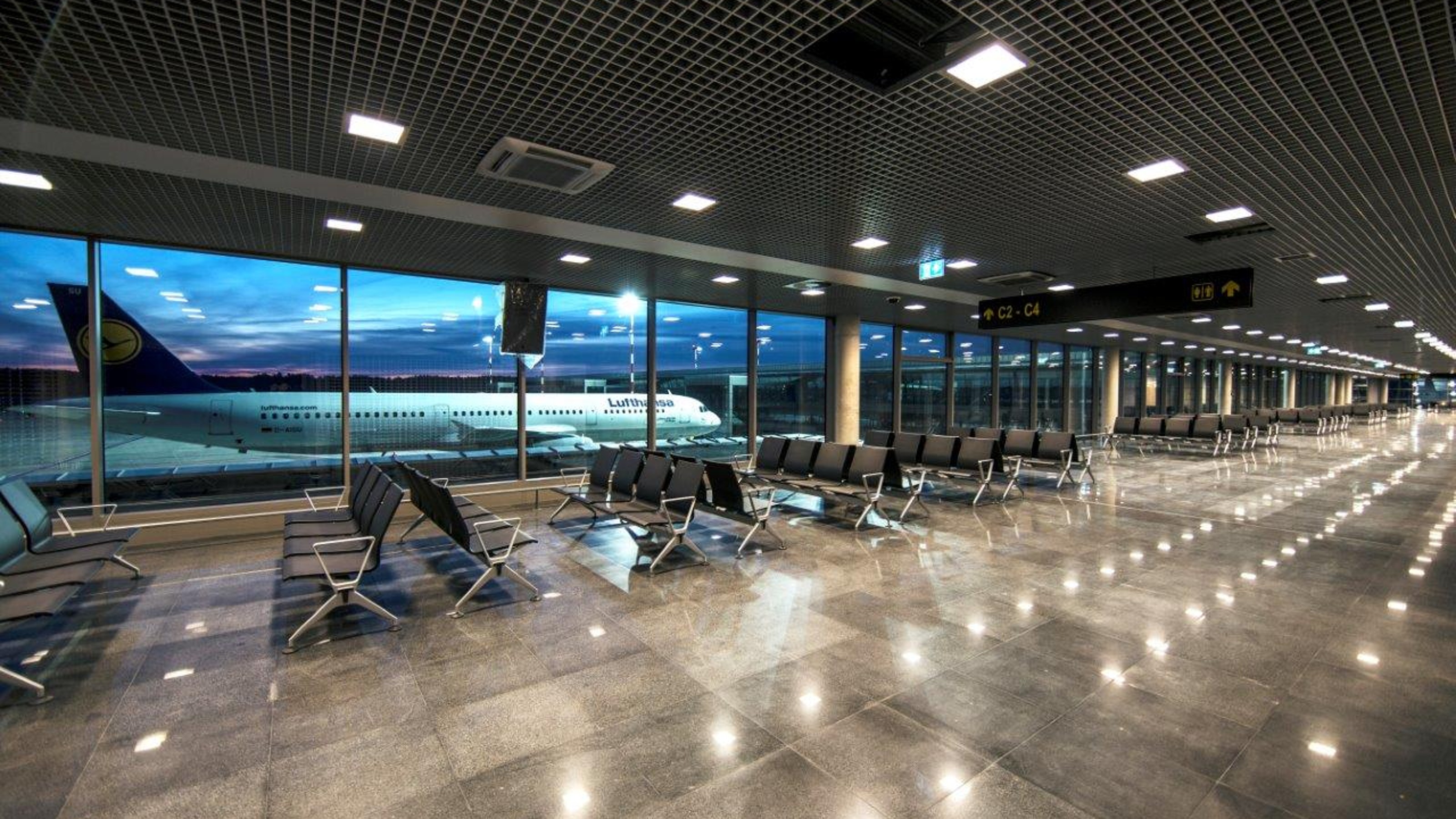Riga International Airport, interior view of the building, gate, aircraft in the background