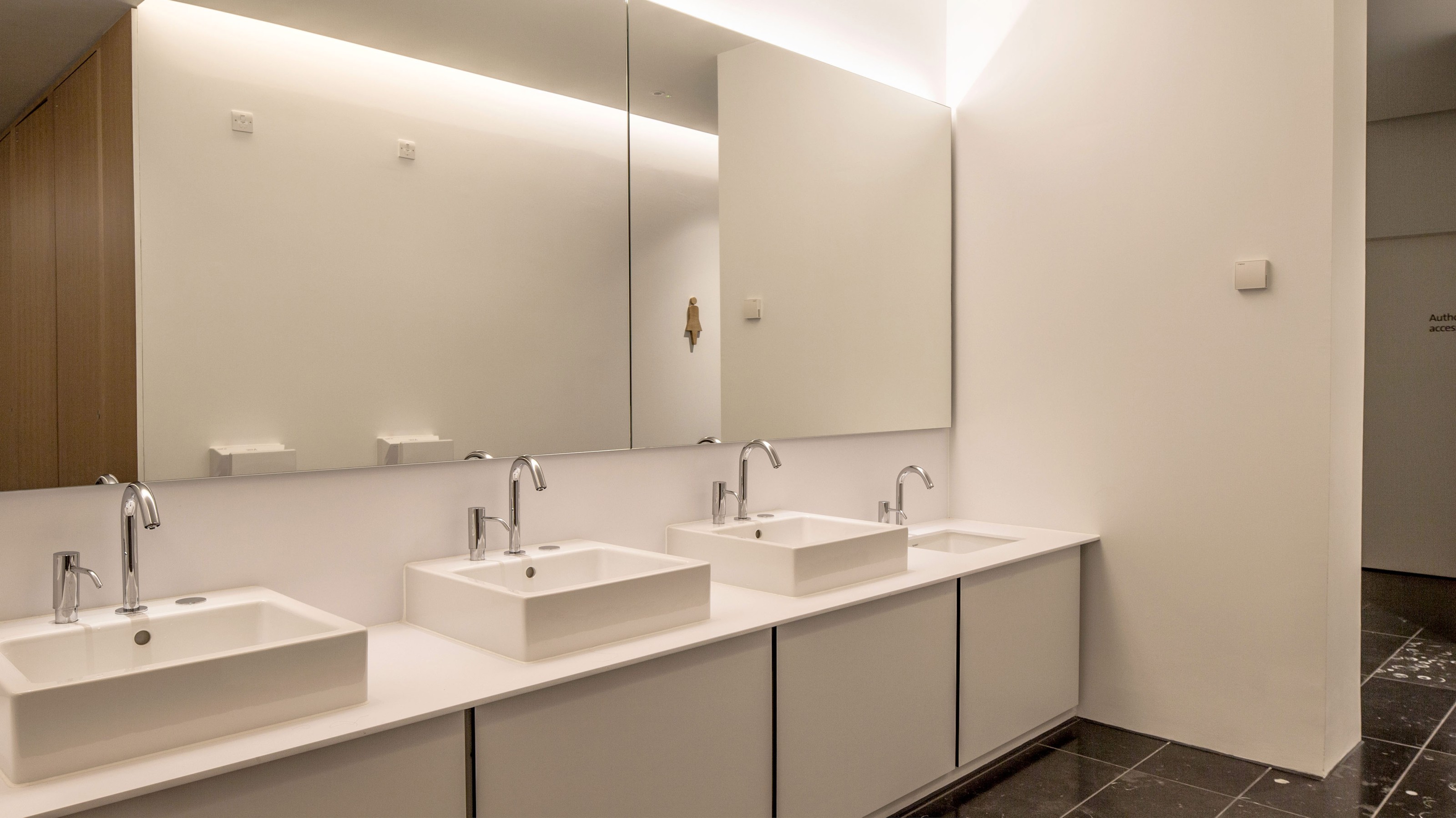 Victoria & Albert Museum Dundee, washbasins with mirror reflecting the toilet cubicles