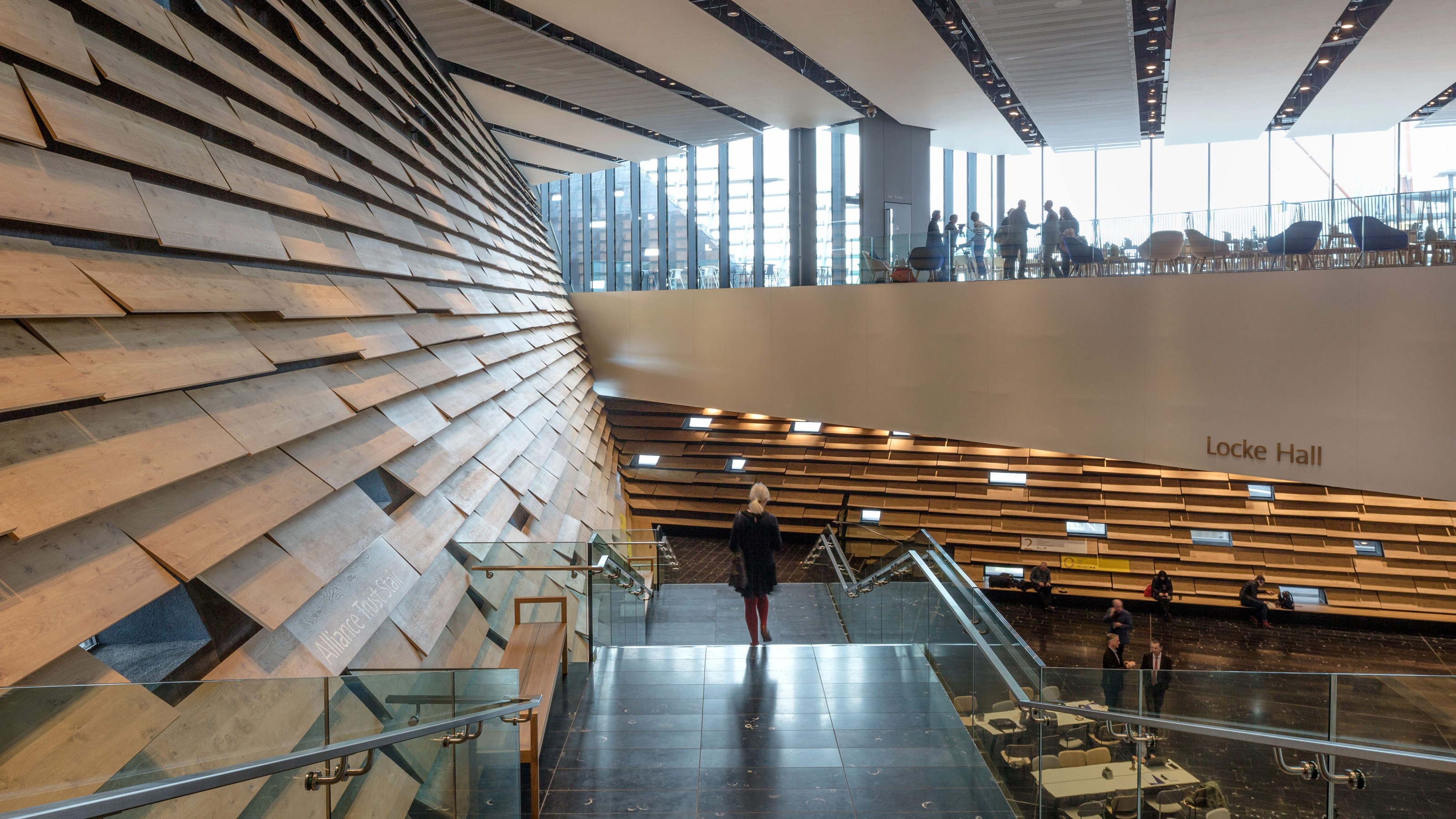 Victoria & Albert Museum Dundee, interior view of the building with a few visitors, stairs in the foreground