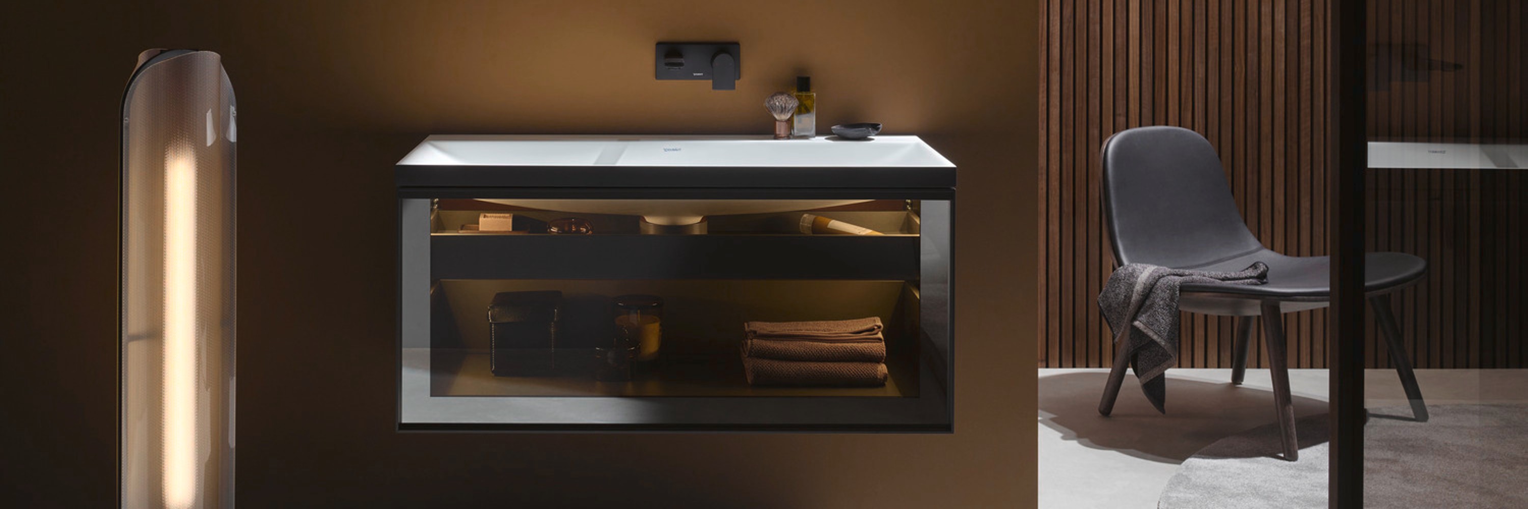 Stylish dark bathroom featuring lighting from Duravit's Vitrium series