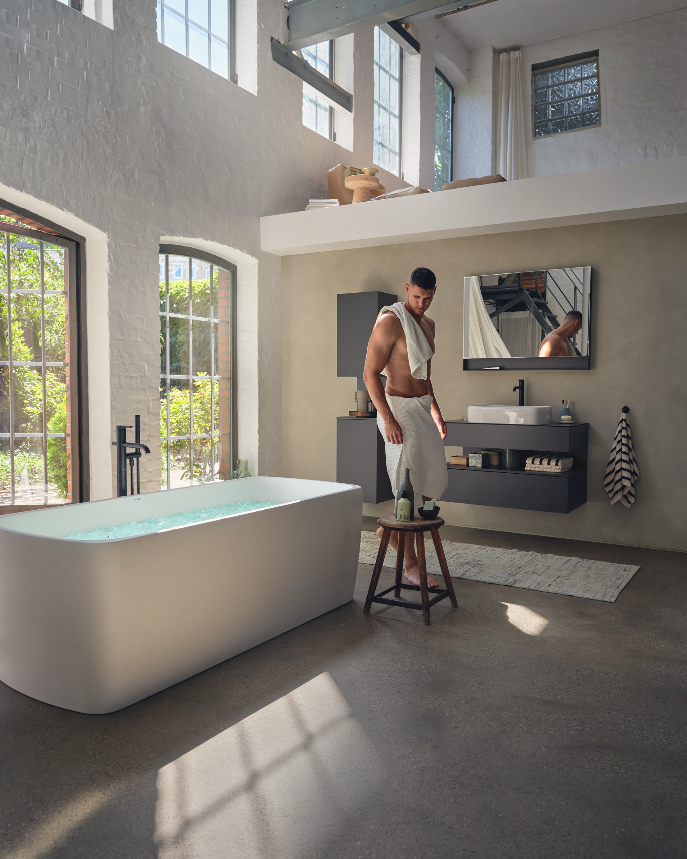 Collection One Complete Bathroom with a Person in Front of the Sink